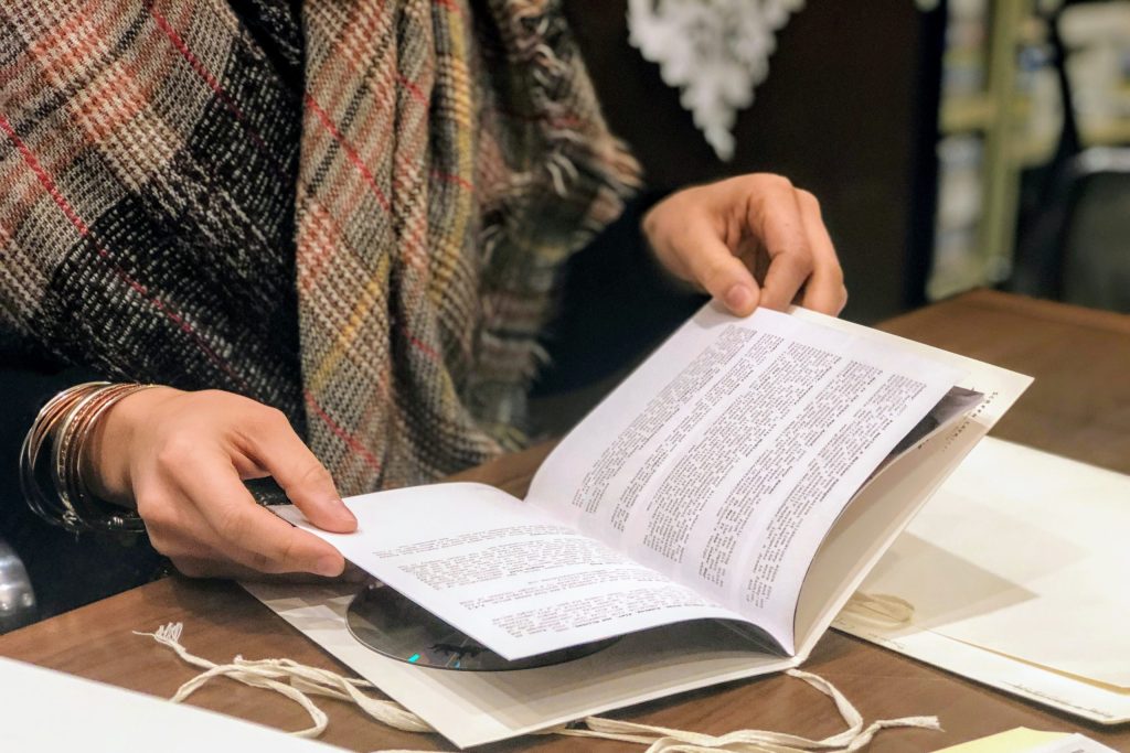 closeup of hands holding a book