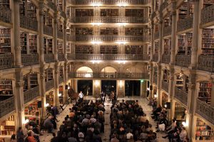 seated audience in the Peabody Library