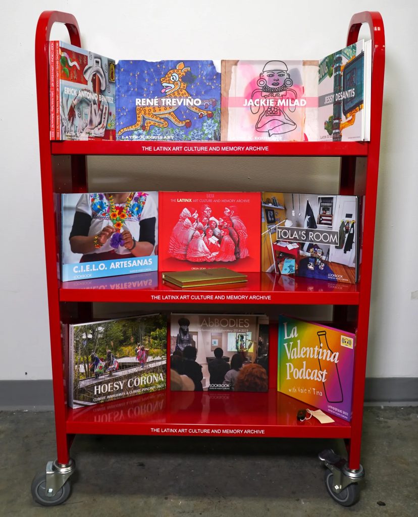 a photo of books on a red book cart