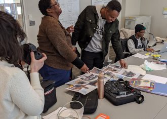 people looking at documents together