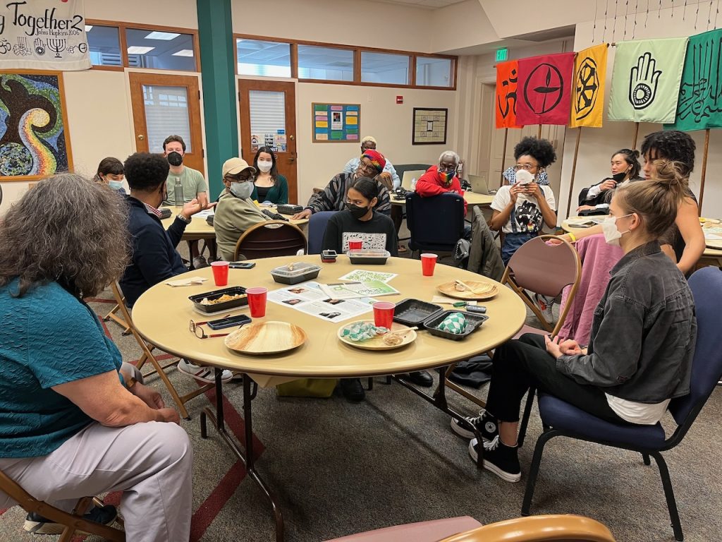 Participants sharing a meal and discussion