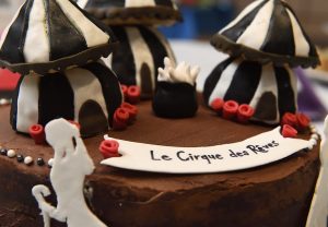 a chocolate cake decorated with a circus