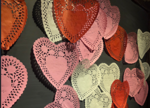 heart shaped doilies on chalk board